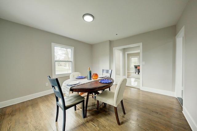 dining area with hardwood / wood-style floors