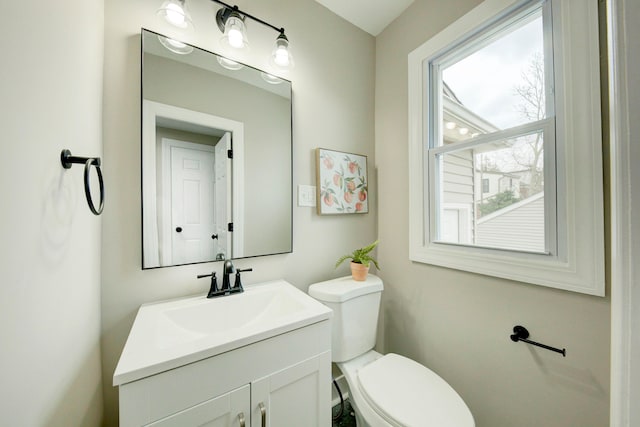 bathroom with toilet and vanity