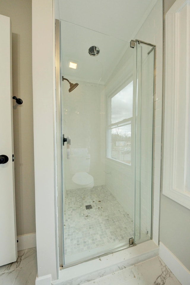 bathroom with walk in shower and tile floors