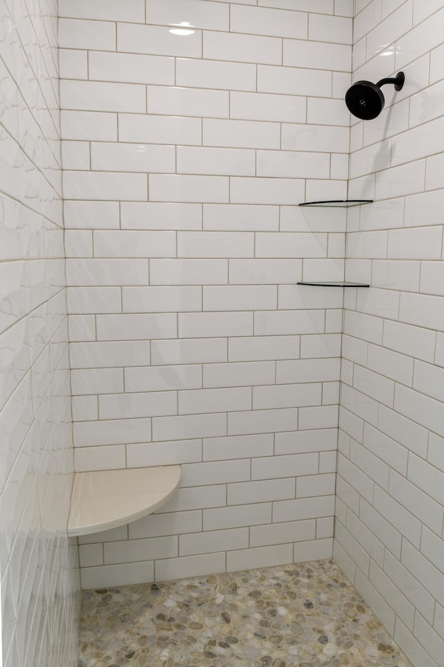 bathroom with a tile shower