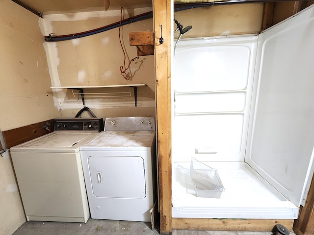 laundry area featuring washing machine and dryer