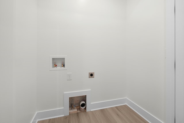 laundry area with hookup for an electric dryer, hookup for a washing machine, and light hardwood / wood-style flooring