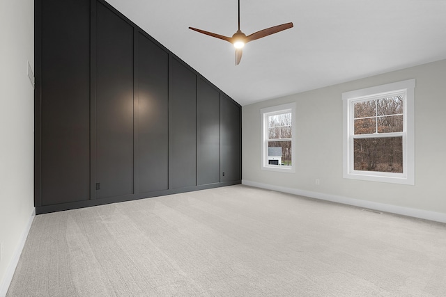 unfurnished bedroom featuring ceiling fan and light carpet