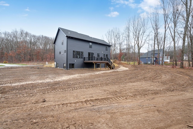 back of property featuring a deck