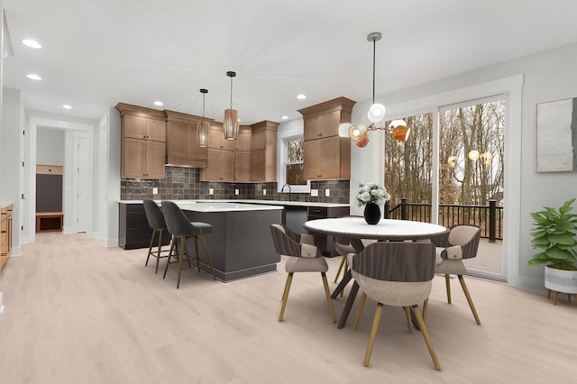 dining area with light hardwood / wood-style flooring