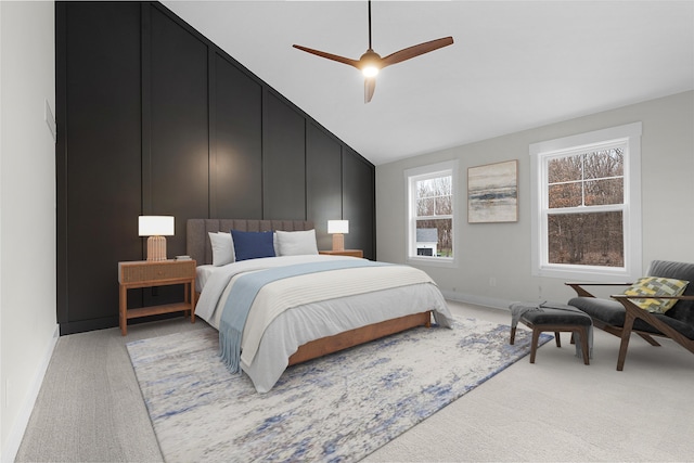 carpeted bedroom featuring ceiling fan and lofted ceiling