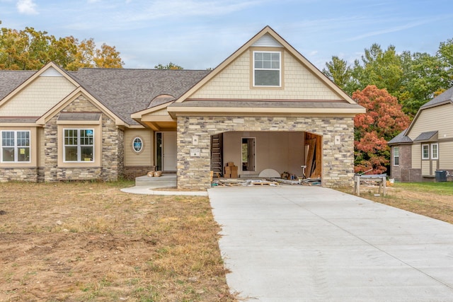 craftsman-style house with a front lawn