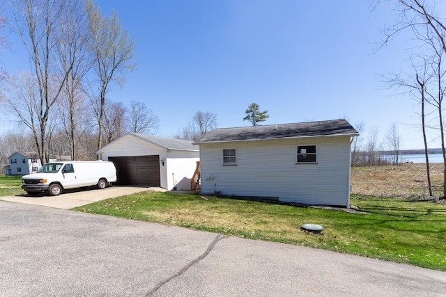 ranch-style home with a garage and a front yard