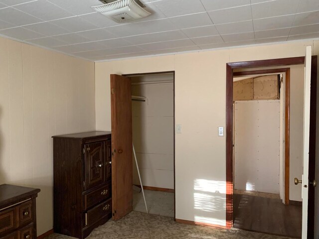 unfurnished bedroom featuring a closet and carpet flooring