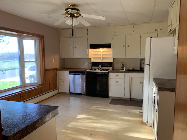 kitchen with a wealth of natural light, white cabinetry, white appliances, and exhaust hood