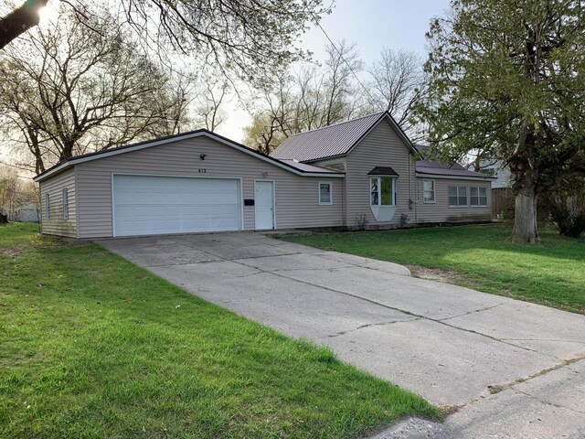 ranch-style house with a front lawn and a garage