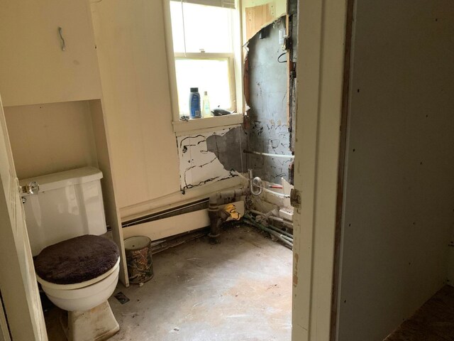 bathroom with a baseboard radiator and toilet