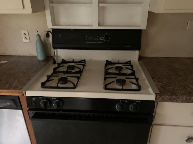 kitchen featuring white cabinetry and white gas range