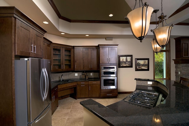 kitchen with pendant lighting, dark brown cabinets, ornamental molding, and stainless steel appliances