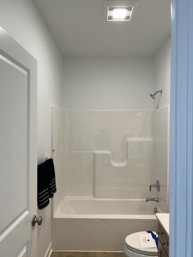 full bathroom with tile patterned floors, vanity, toilet, and washtub / shower combination