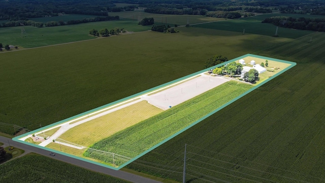 birds eye view of property with a rural view