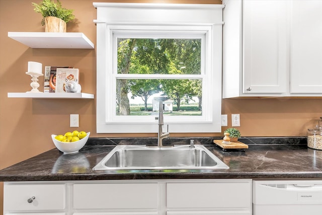 details featuring white cabinets, dishwasher, and sink