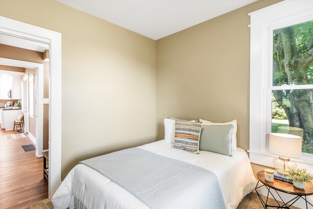 bedroom with hardwood / wood-style floors