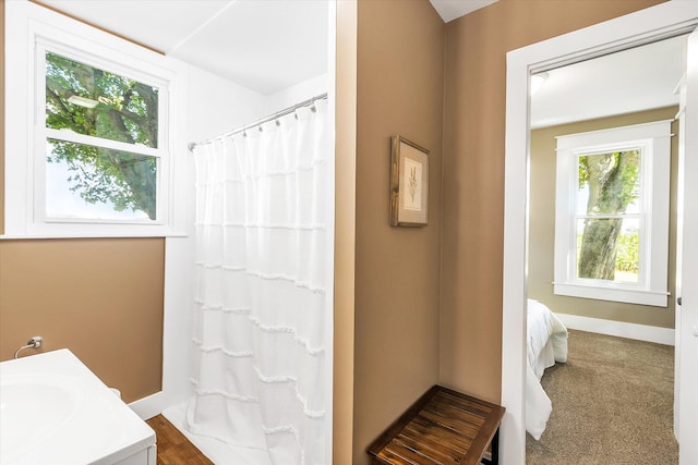 bathroom with vanity and curtained shower