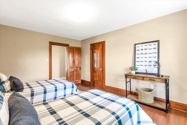 bedroom with hardwood / wood-style flooring