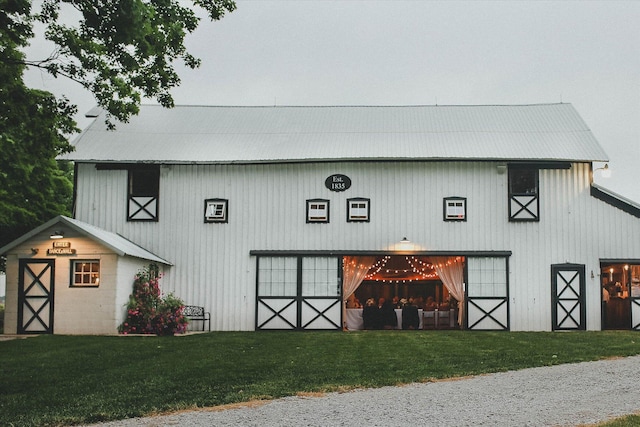 view of outdoor structure with a lawn