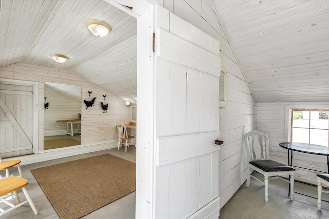 bonus room with wood walls, lofted ceiling, and wood ceiling