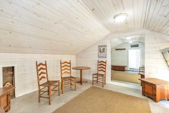 sitting room with wood walls, wood ceiling, and lofted ceiling