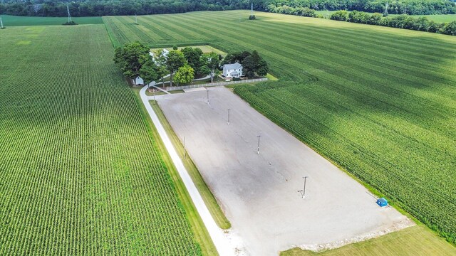 birds eye view of property with a rural view