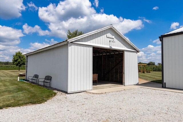 view of outdoor structure featuring a lawn