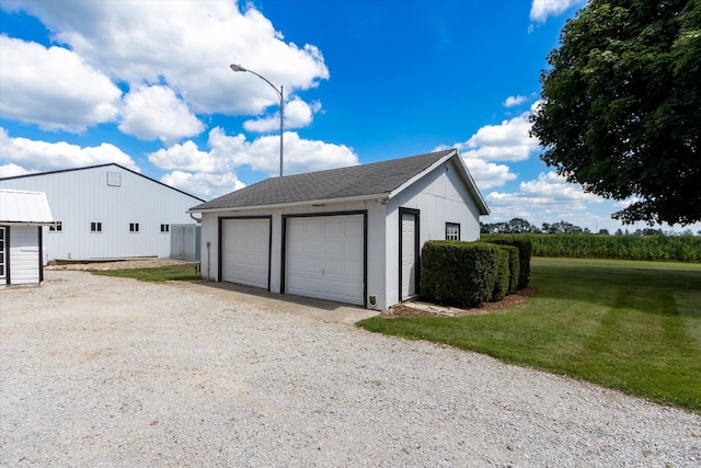 garage featuring a yard