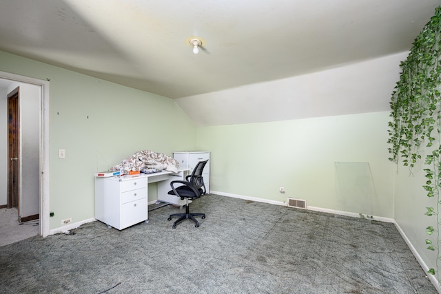 home office with lofted ceiling and carpet floors