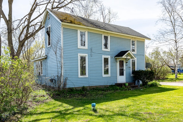 colonial home with a front yard