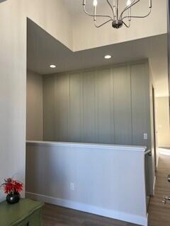 412 Coventry Rd, Battle Creek, MI 49015 - interior space with an inviting chandelier, elevator, dark wood-type flooring, and baseboards
