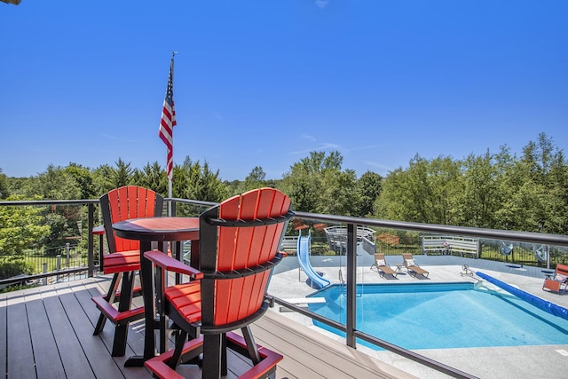 wooden deck featuring a covered pool