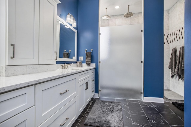 bathroom featuring a shower and vanity