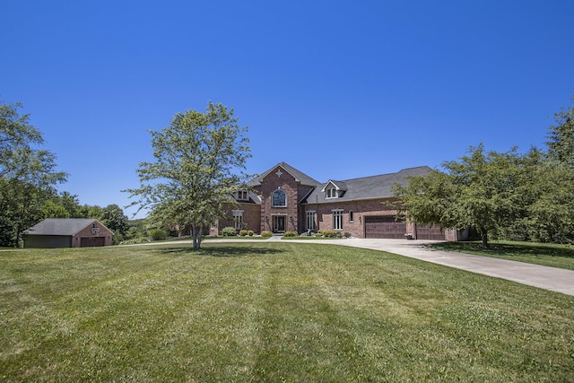 view of front facade with a garage and a front yard