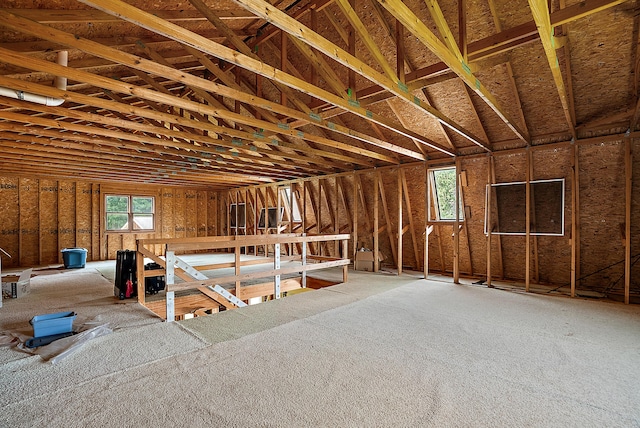 misc room with a wealth of natural light and an upstairs landing