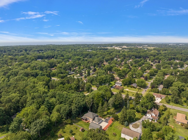 birds eye view of property with a wooded view