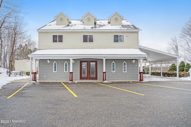 view of front facade featuring french doors and a carport