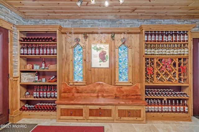 mudroom with wood ceiling and tile flooring