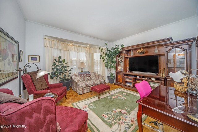 living room featuring crown molding and parquet flooring