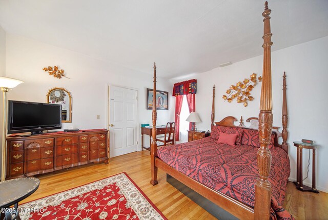 bedroom with hardwood / wood-style floors