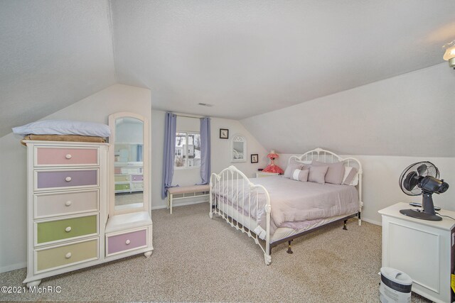 bedroom with light colored carpet and lofted ceiling