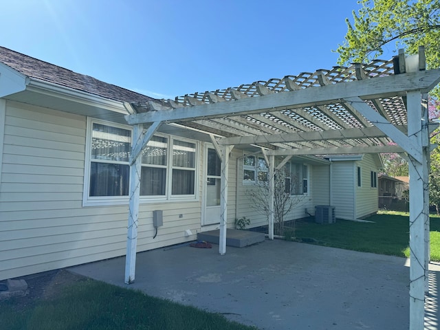 rear view of property featuring a patio area, a pergola, and central air condition unit