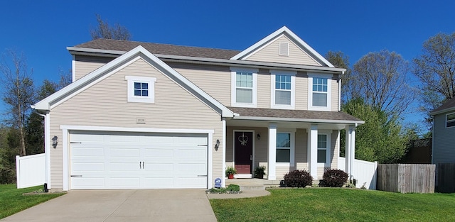 view of front facade with a garage and a front lawn