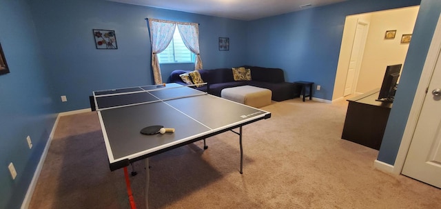 recreation room with light colored carpet