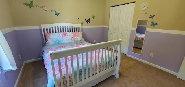 bedroom with a closet and carpet floors