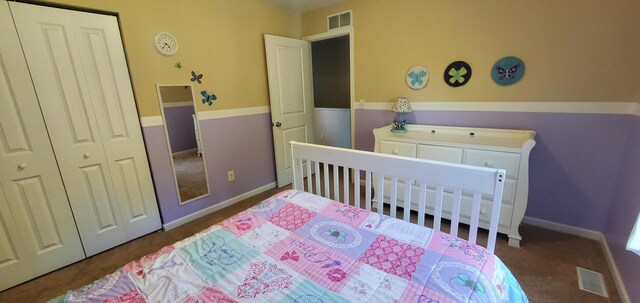 carpeted bedroom featuring a closet