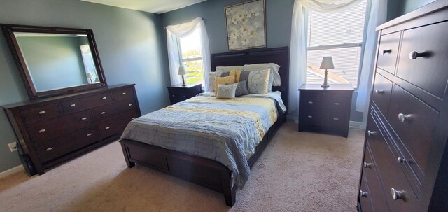 bedroom with light colored carpet