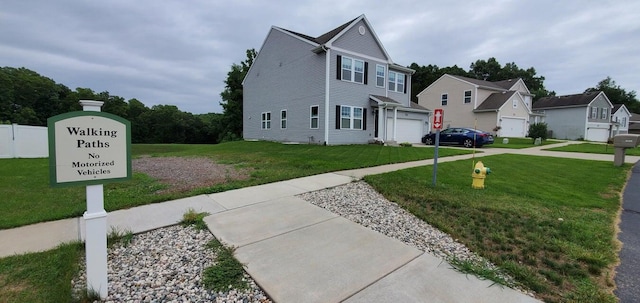 view of front facade featuring a garage and a front lawn